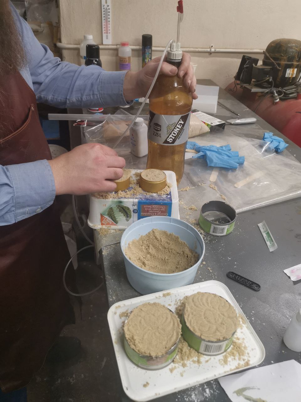 CO2 from vinegar and baking soda is fed into sample molds